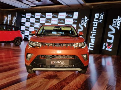 mahindra kuv100 nxt fiery orange front